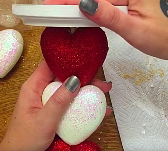 Learn to make a DIY Glitter Heart Candle Holder for a Valentine's Day Decoration