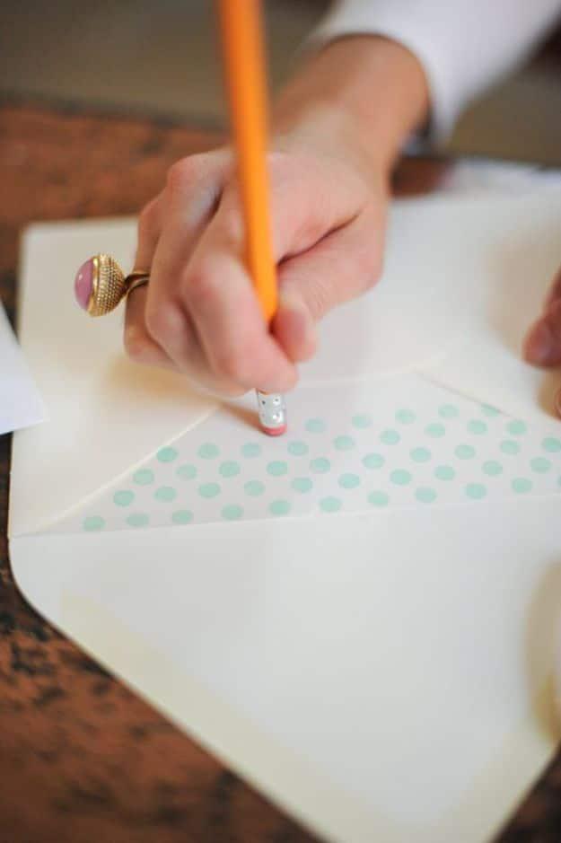 DIY Polka Dot Envelope Liner, cheap to pull off with dollar store finds and a piece worth keeping out on display