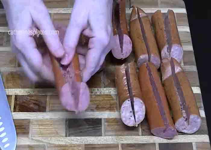 Cutting a slit to the sausage