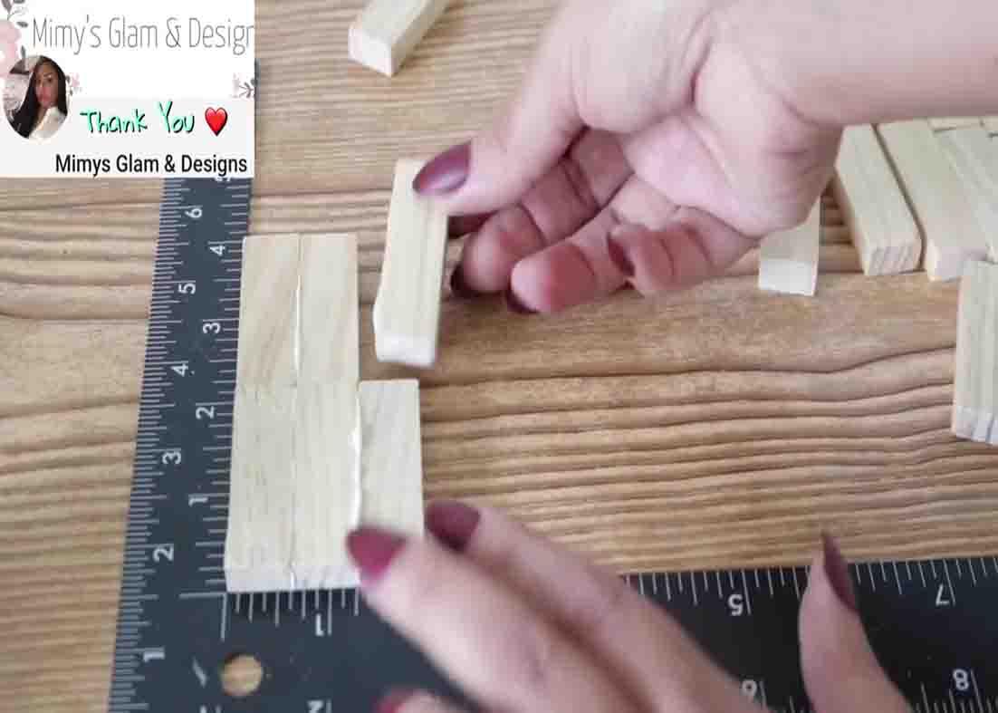 Gluing the Jenga piece to make the base of the mug holder