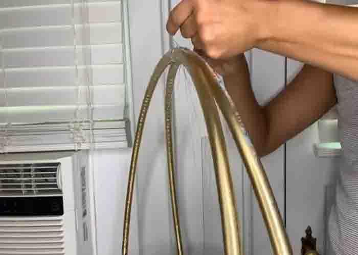 Attaching the cupcake holder to the DIY cupcake stand using hula hoops