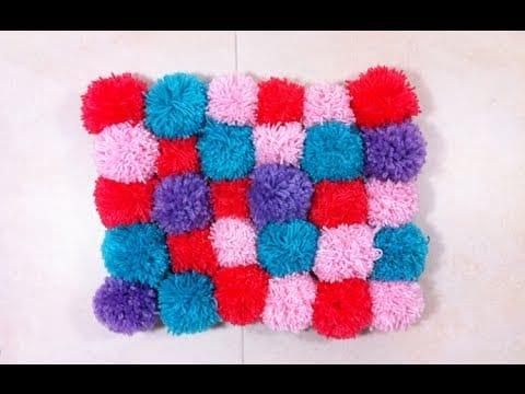 Cozy Soft And Plush Pom Pom Rug, a handmade option that beats a store bought rug and easy to make your own