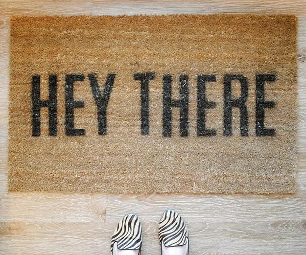 Hand painted coir doormat stenciled in a custom design, a durable porch craft that sells well to new homeowners