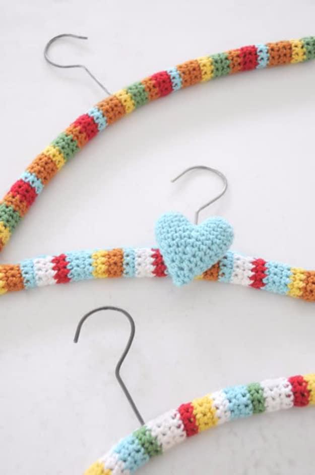 Crochet Hangers, budget friendly using stuff already sitting in a bin and warmth that a plain corner was missing