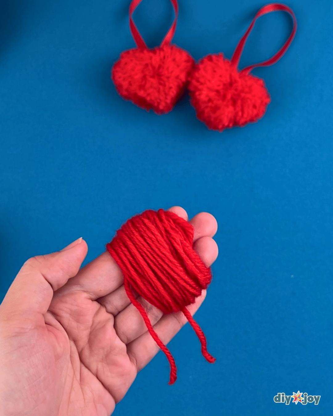 Pom Pom Hearts — how to make a pom pom with yarn