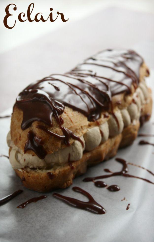 Coffee cream filled eclair with chocolate glaze drizzled over the top and pale coffee cream at the cut edge
