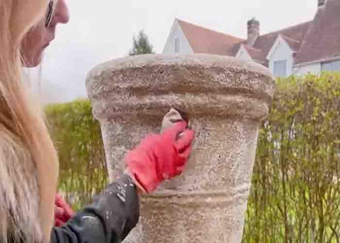 Adding finishing touches to finish the stone look outdoor planter