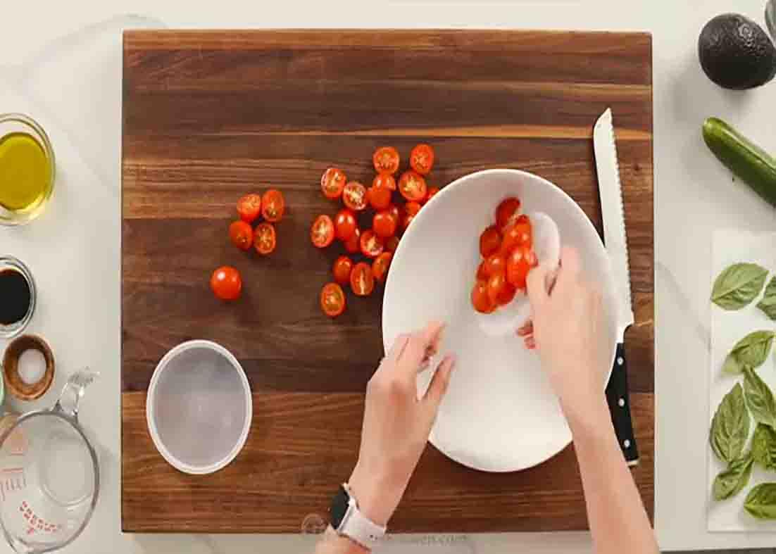 Preparing the tomato cucumber salad recipe