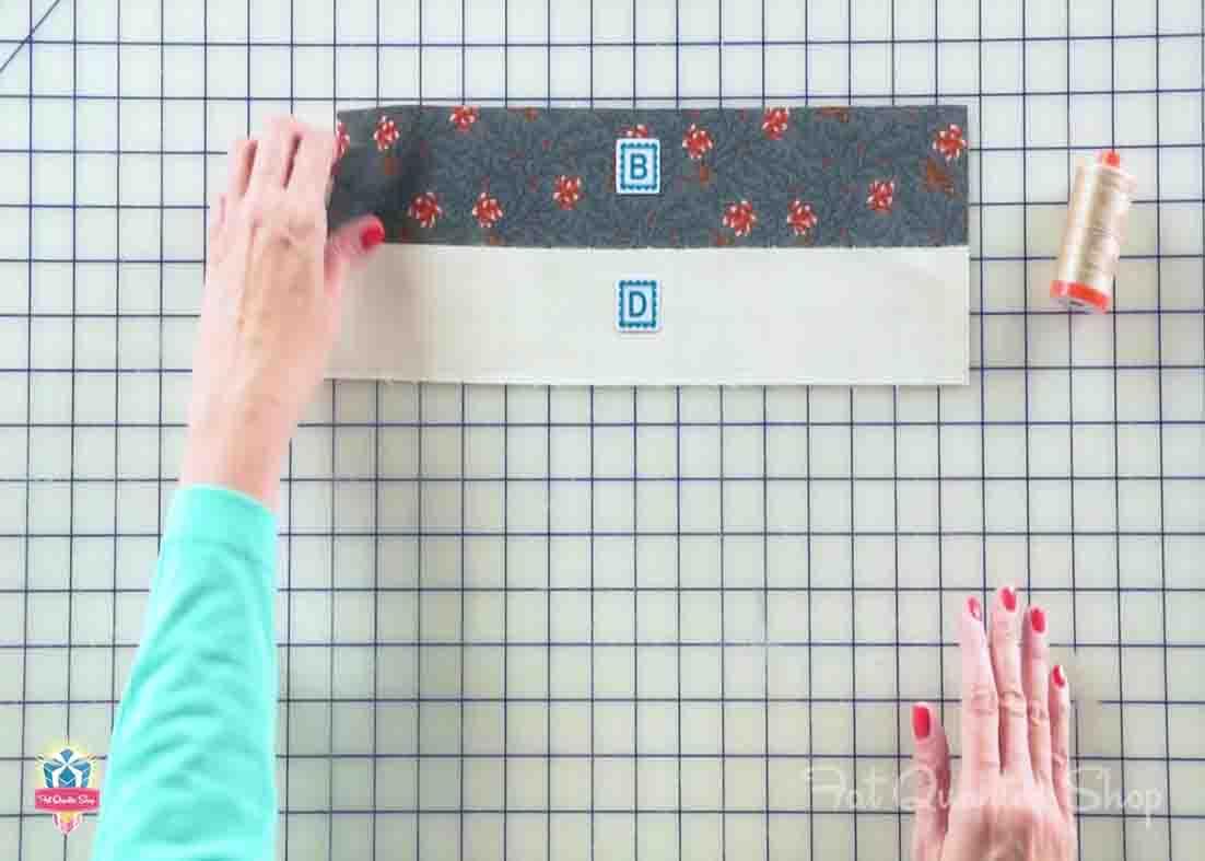 Stitching the two fabric strip for the Jacob's ladder quilt block