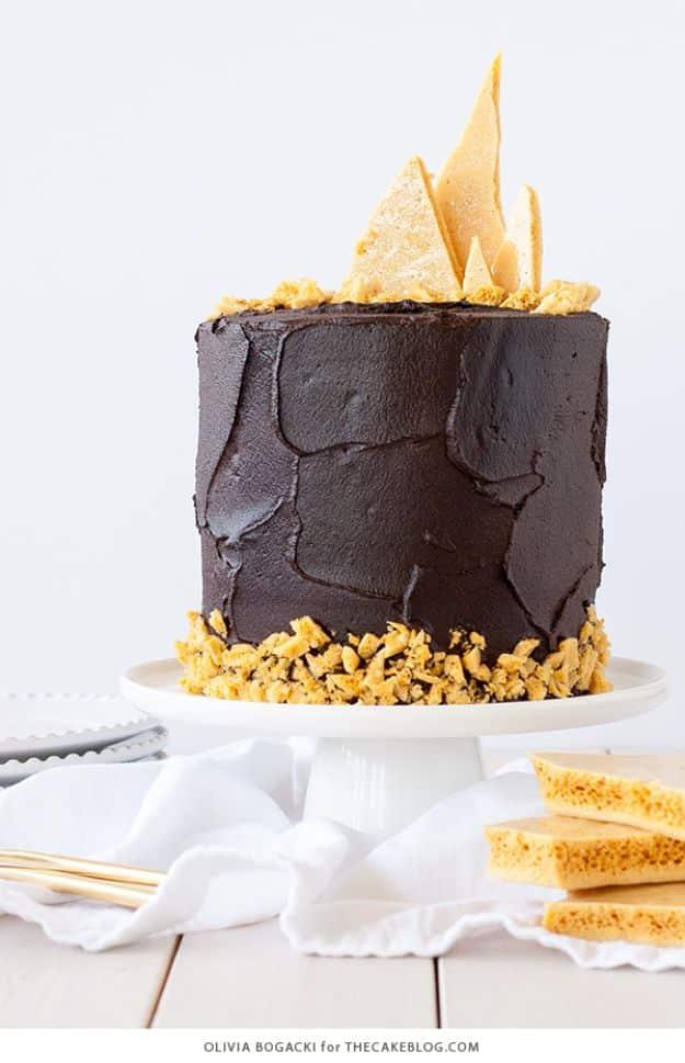 Dark chocolate honeycomb cake topped with shards of brittle homemade honeycomb for a birthday recipe for a celebration