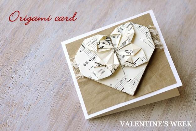 Origami Valentine's card with a paper heart folded from old sheet music mounted over a strip of lace