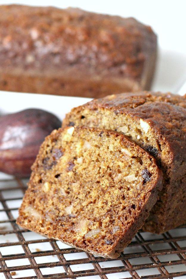 Fig date nut bread sliced on a wire cooling rack showing dark fruit and chopped nuts in the dense crumb