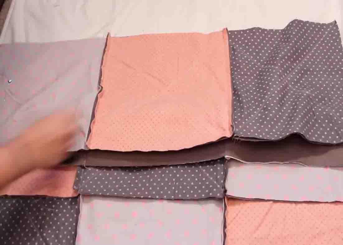 Sewing the rows to make the baby blanket quilt