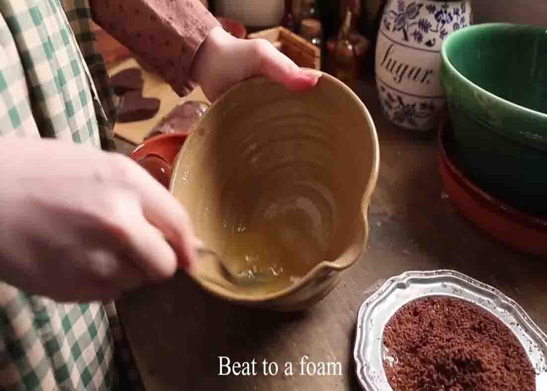 Beating the egg whites for the old-fashioned cookies
