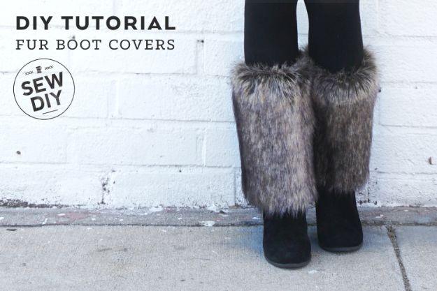 Fur boot covers, gray faux fur boot covers worn over short black ankle boots against a white brick wall