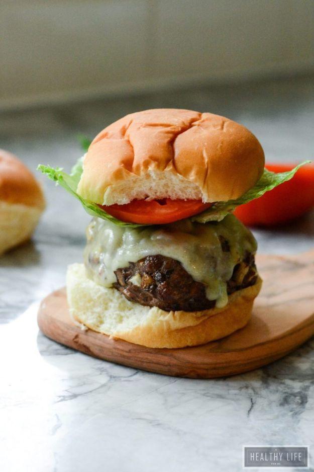 Mushroom beef burgers with diced gourmet mushrooms in the patty and melted swiss cheese on a soft bun