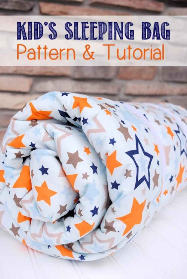 Sewing projects for boys kid's sleeping bag rolled and tied, made in a soft cotton star print in orange, gray and blue