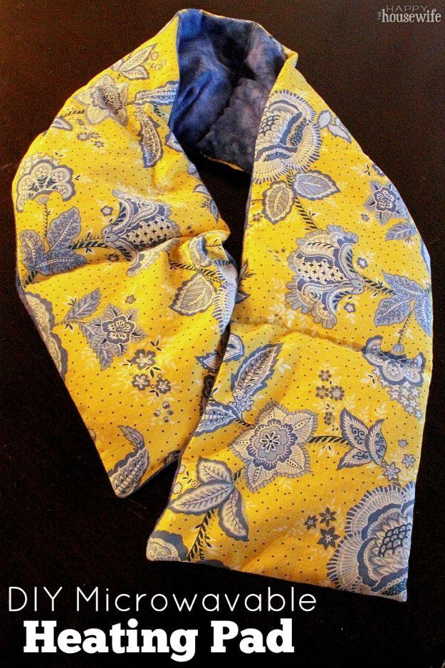 DIY microwavable heating pad graphic, a long yellow and blue paisley fabric wrap curved on a dark surface, name typeset below