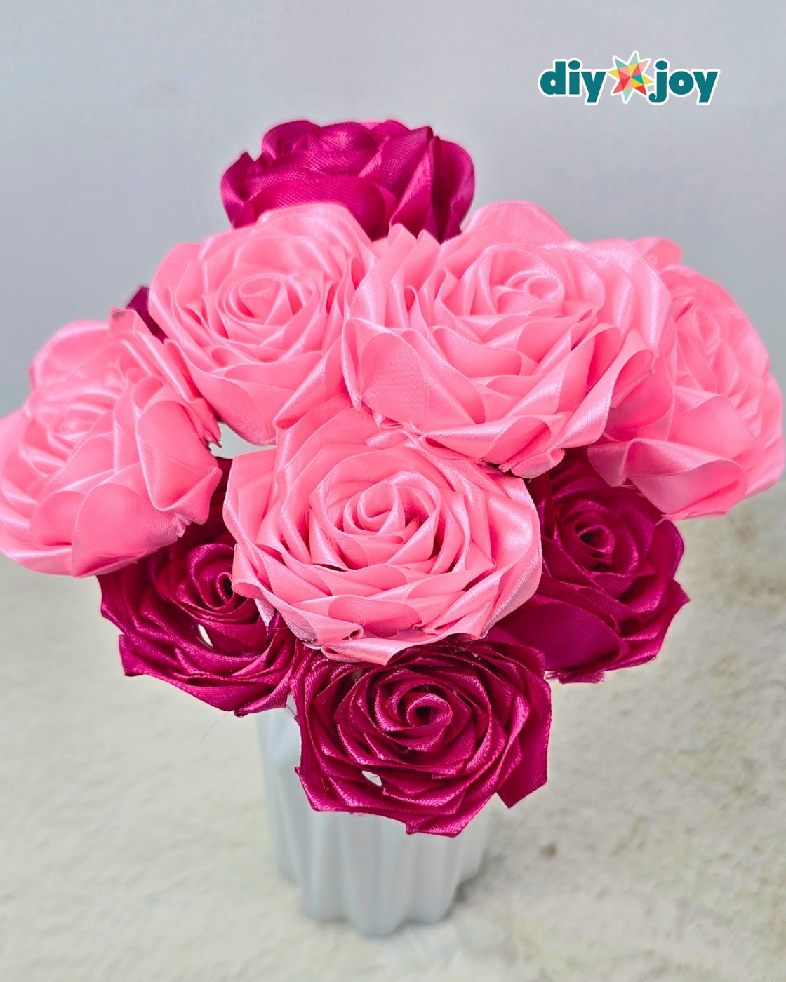 Satin ribbon rose for Mothers Day, a handmade ribbon flower on a stem ready for a bouquet or a wrapped gift
