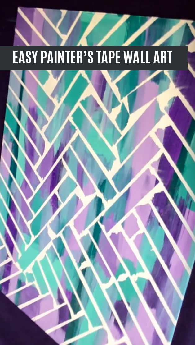 Painters tape wall art canvas in teal, purple and violet with crisp white chevron lines left by the removed tape