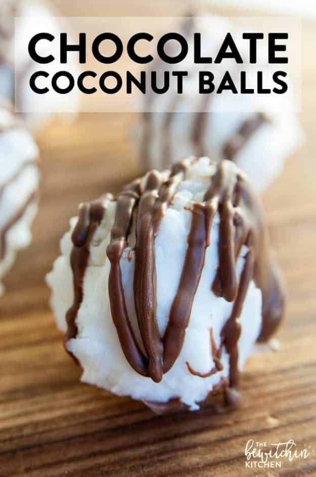 Chocolate coconut balls drizzled with melted chocolate on parchment paper, a four ingredient treat, an easy no bake dessert