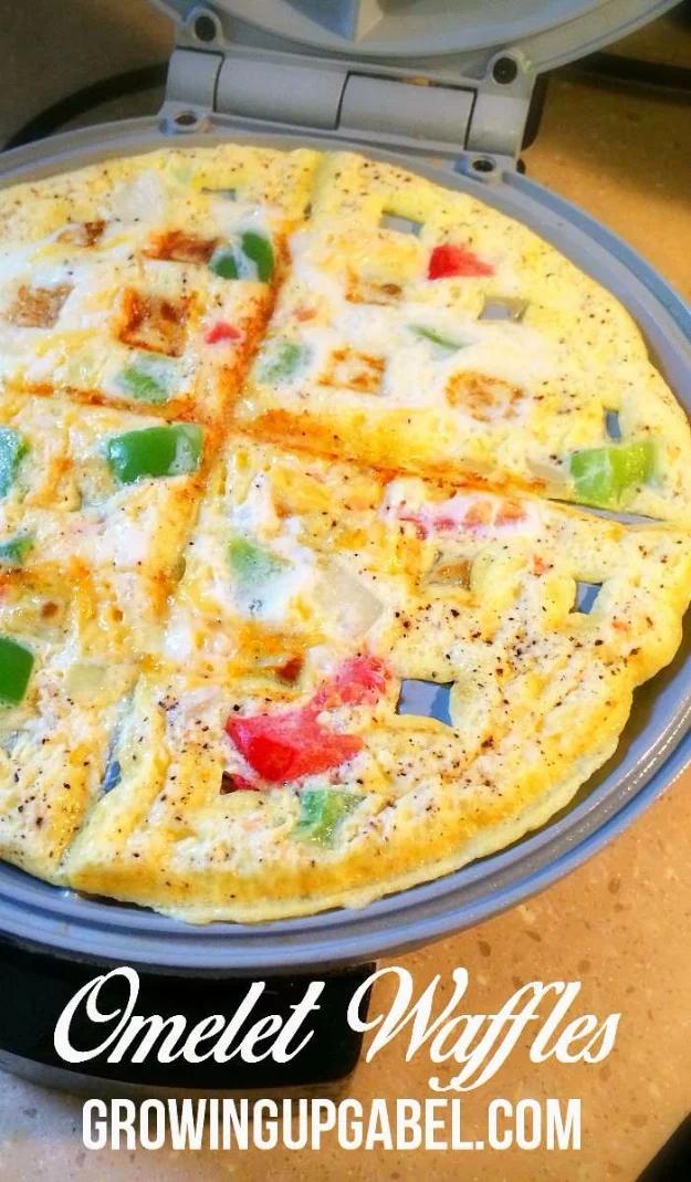 Waffle omelet with peppers, onions and tomato cooked in a waffle iron into a firm, ridged round of egg