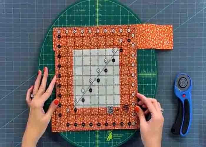 Trimming the block for the jelly roll scrap quilt