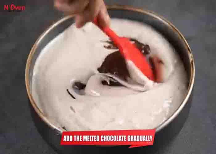 Mixing the melted chocolate and banana puree together