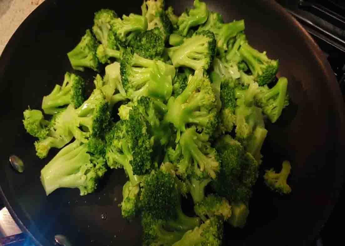 Steaming the broccoli for the cheesy broccoli recipe