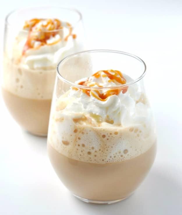 Starbucks caramel brulee latte copycat in a mug with frothed milk, whipped cream and caramel drizzle
