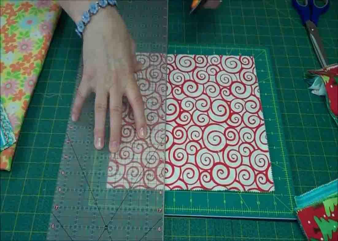 Measuring the layer cakes for the quilt