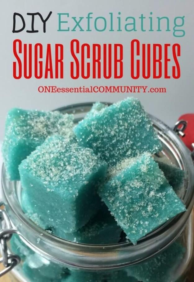 DIY exfoliating sugar scrub cubes, bright turquoise sugar cubes with sugar crusted tops stacked in a jar