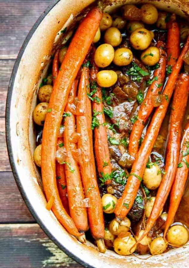 Chuck roast braised in a dutch oven with balsamic, Dijon, small potatoes and carrots with the tops on