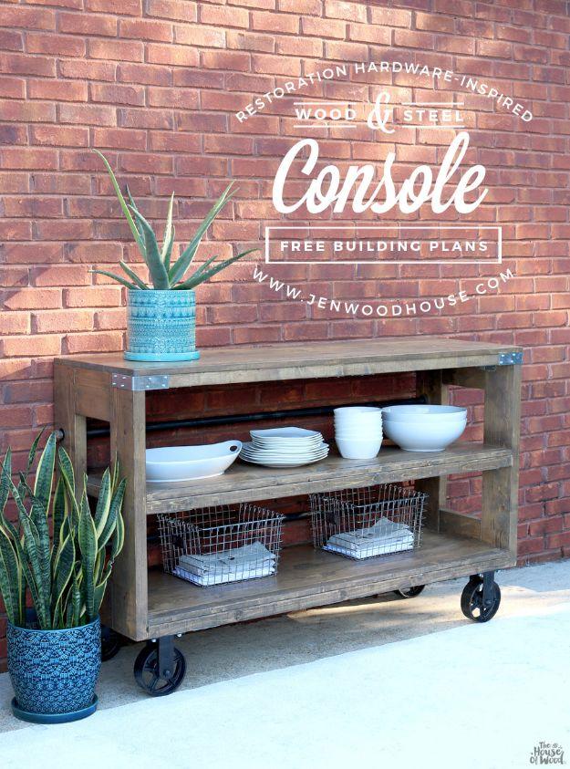 Industrial wood and steel console on large black casters against a brick wall, stacked with white bowls and plates