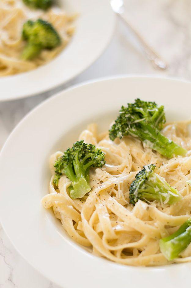 Easy fettuccine alfredo with broccoli, long pasta and green florets coated in a pale creamy parmesan sauce