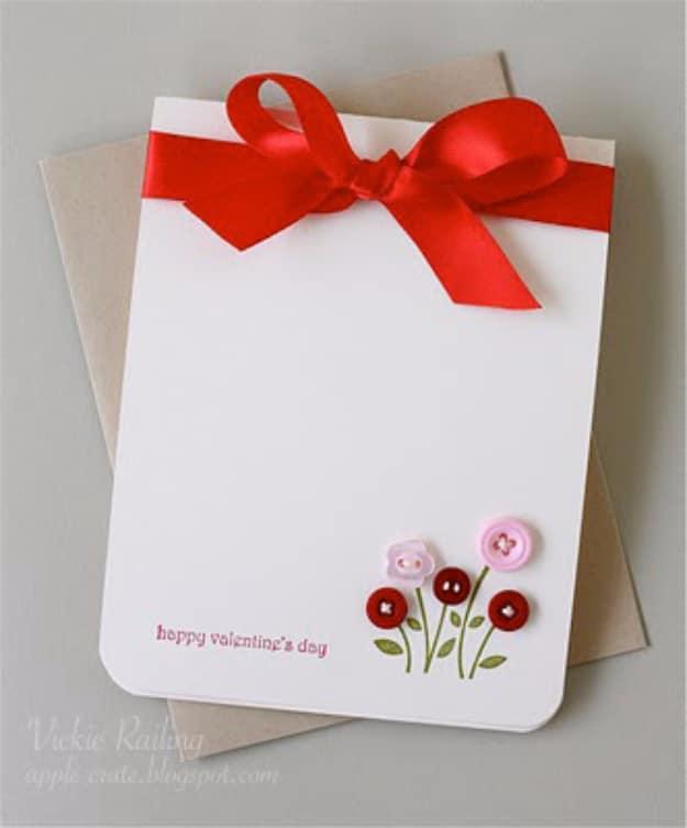 Valentine button bouquet card with colorful buttons stitched as flower heads above stamped stems and ribbon