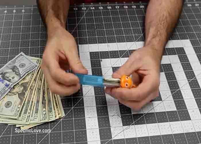 Hide money in PEZ dispenser before gifting it