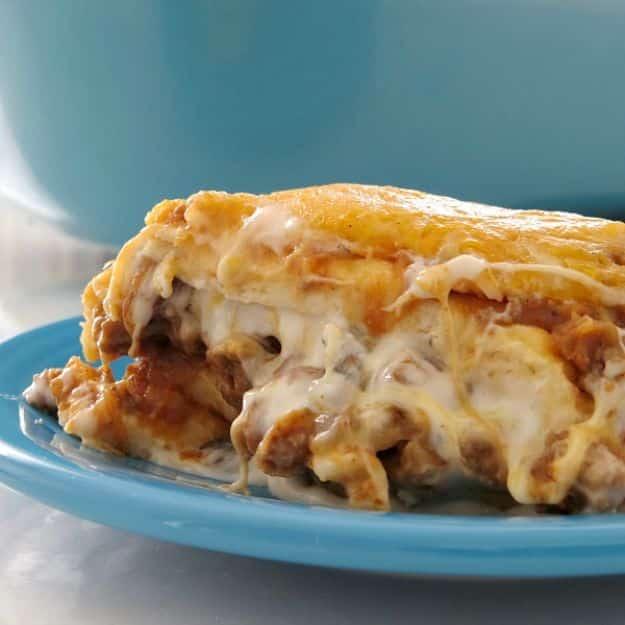 Baked burrito casserole with seasoned ground beef, a creamy filling and a thick layer of melted cheese
