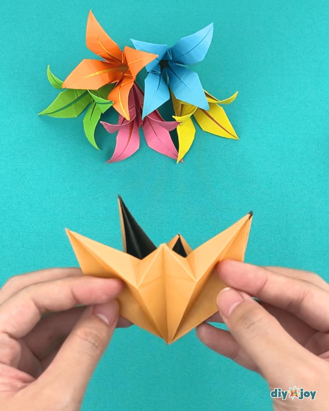 Easy lily flowers with paper, folded blooms in several colors ready for a simple handmade craft project