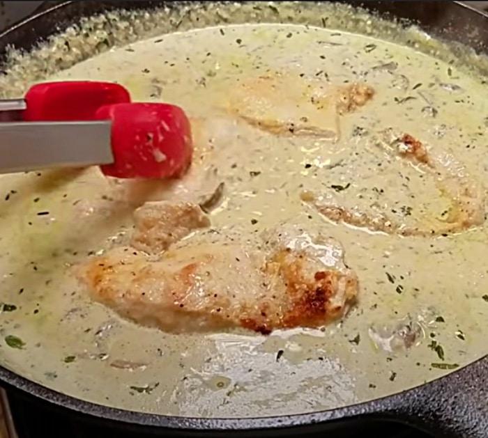 Garlic chicken with half and half over arugula