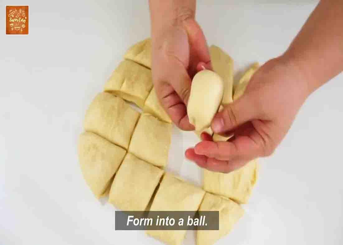 Forming the buttery soft buns from the dough pieces