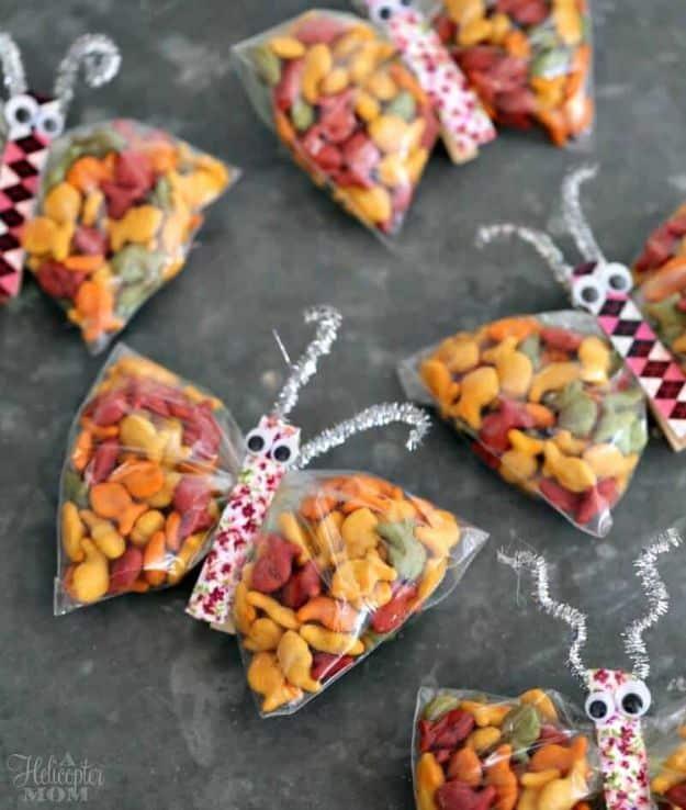 Snack butterflies made from bags of goldfish crackers clipped in clothespins with pipe cleaner antennae