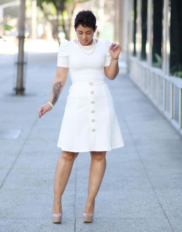 DIY clothes for winter, a woman in a white button front flared skirt and white short sleeve top with nude heels