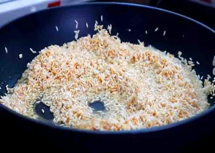 Stir-frying the rice before seasoning it