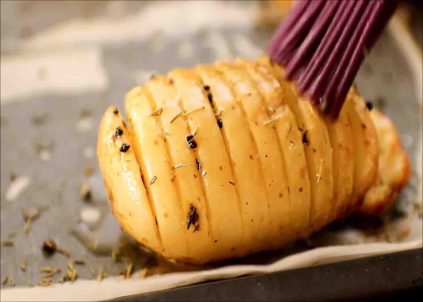 Brushing some butter mixture to the potato