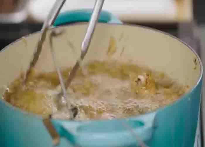 Frying the chicken in an old-fashioned way