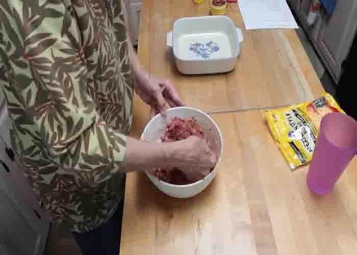 Mixing the cowboy meatloaf mixture