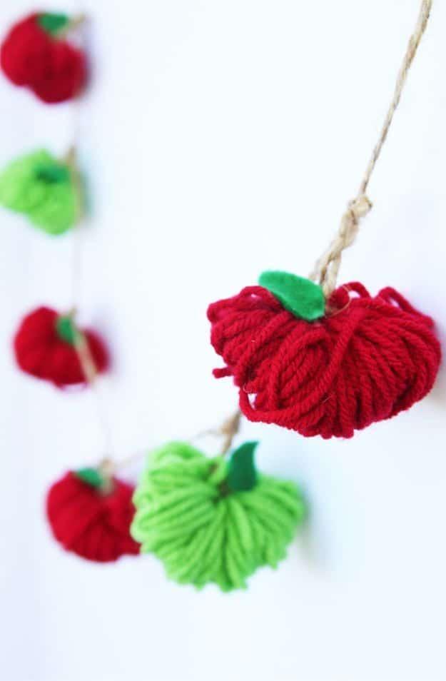 DIY apple craft with creative seasonal tutorial and rustic autumn home accent, showing the finished apple yarn garland