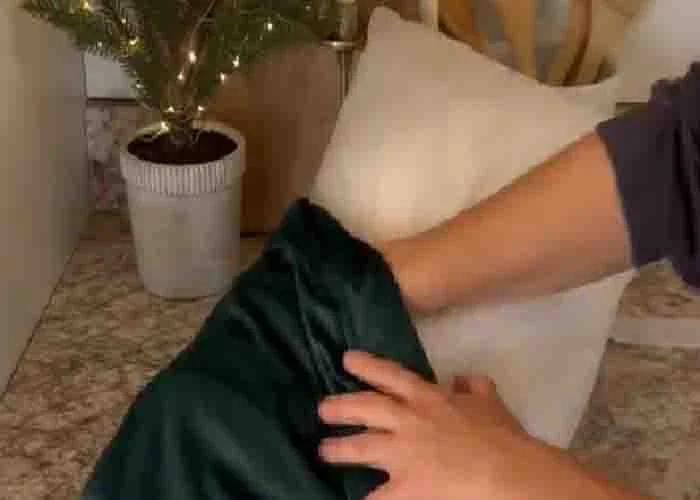 Inserting the pillow inside the velvet pillow cover