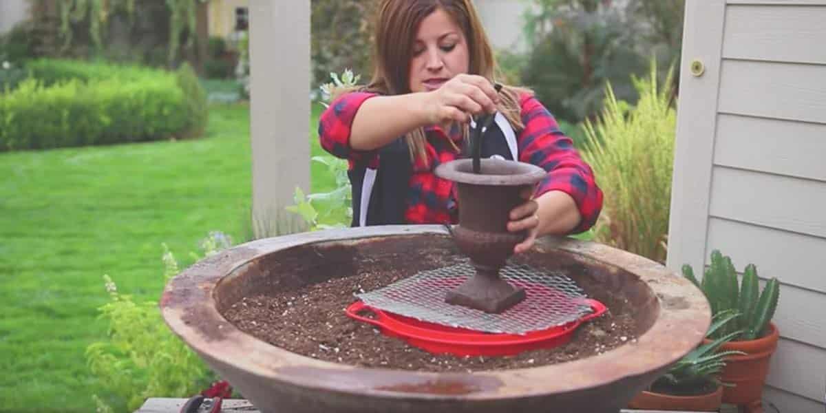 She Sets Up A Fountain In A Big Planter And What She Does Next Is Fabulous (Watch!)